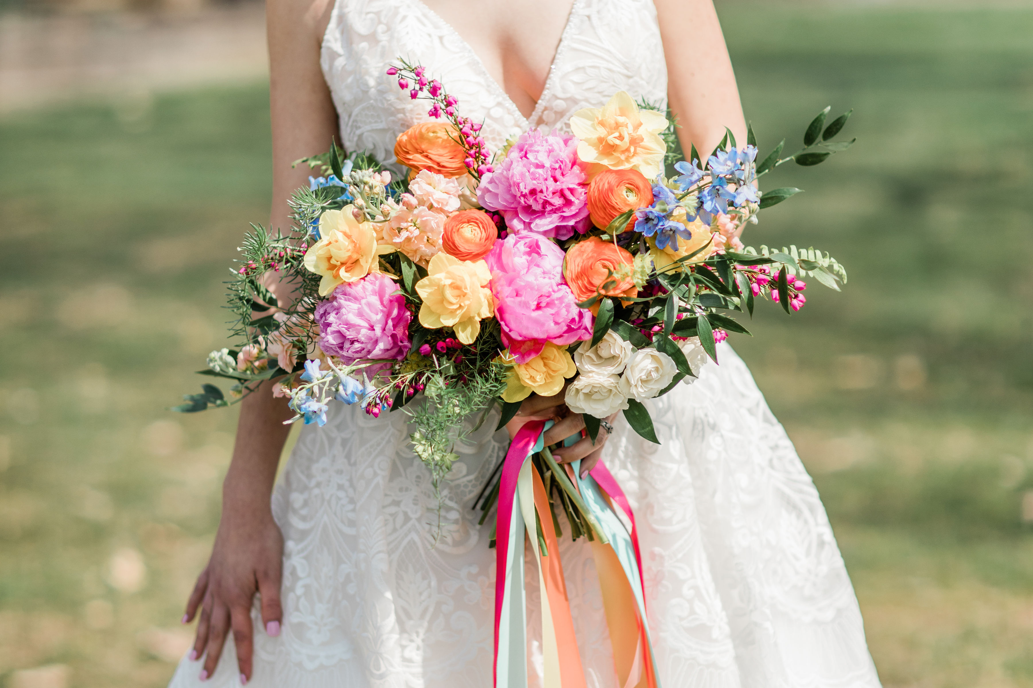 brightly colored spring bouquet created by emerald design of evansville indiana