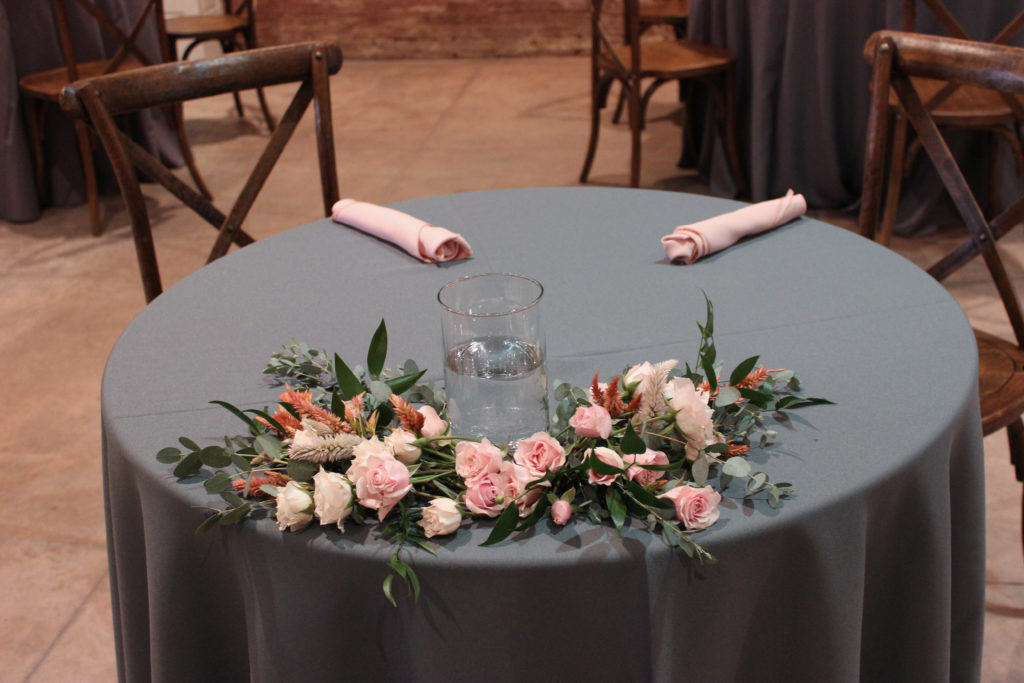 Sweetheart table for at evansville wedding venue city view at sterling square, flowers by evansville florist emerald design