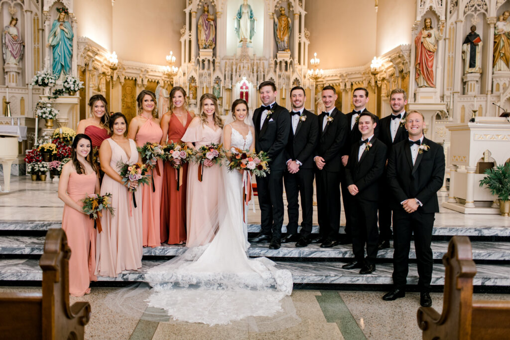 fall wedding ceremony at saints mary and john catholic parish in evansville indiana, flowers by emerald design, photo by morgan marie photography
