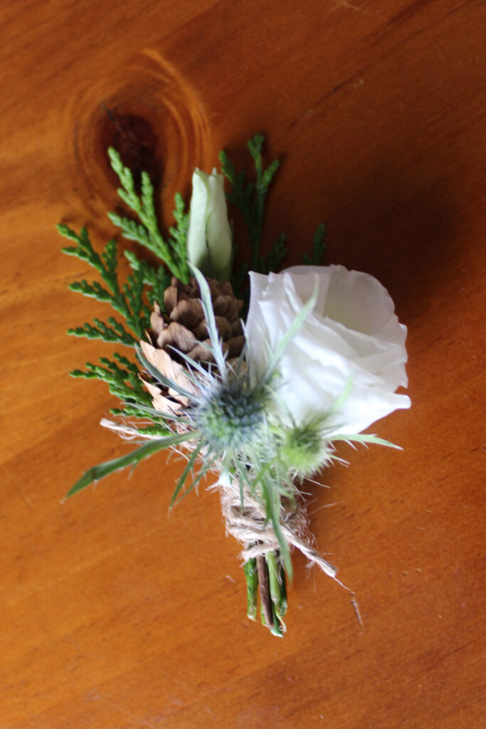 Boutonniere for a winter wedding created by Evansville florist Emerald Design